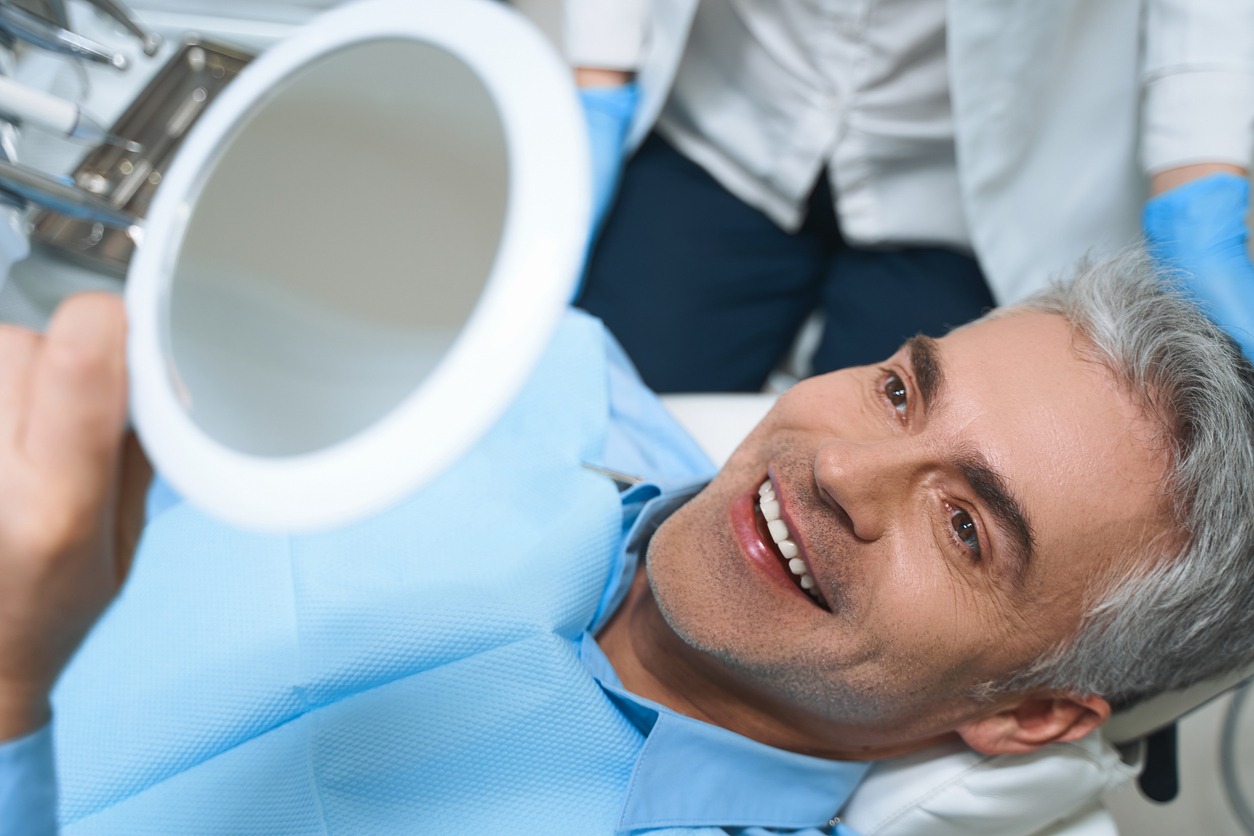 smiling man implant bridge