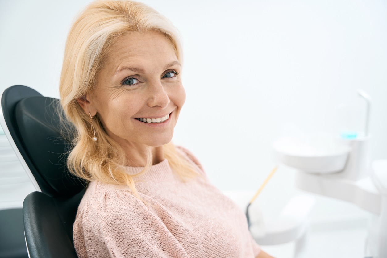 woman smiling with dental implants