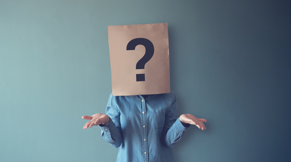 Woman has Confused, Thinking, Question Mark Icon on Paper Bag, copy space