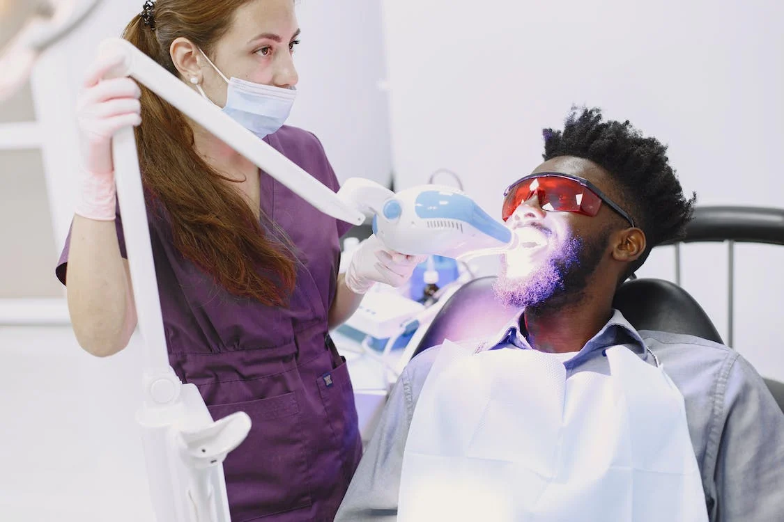 Dentist-Whitening-Mans-Teeth