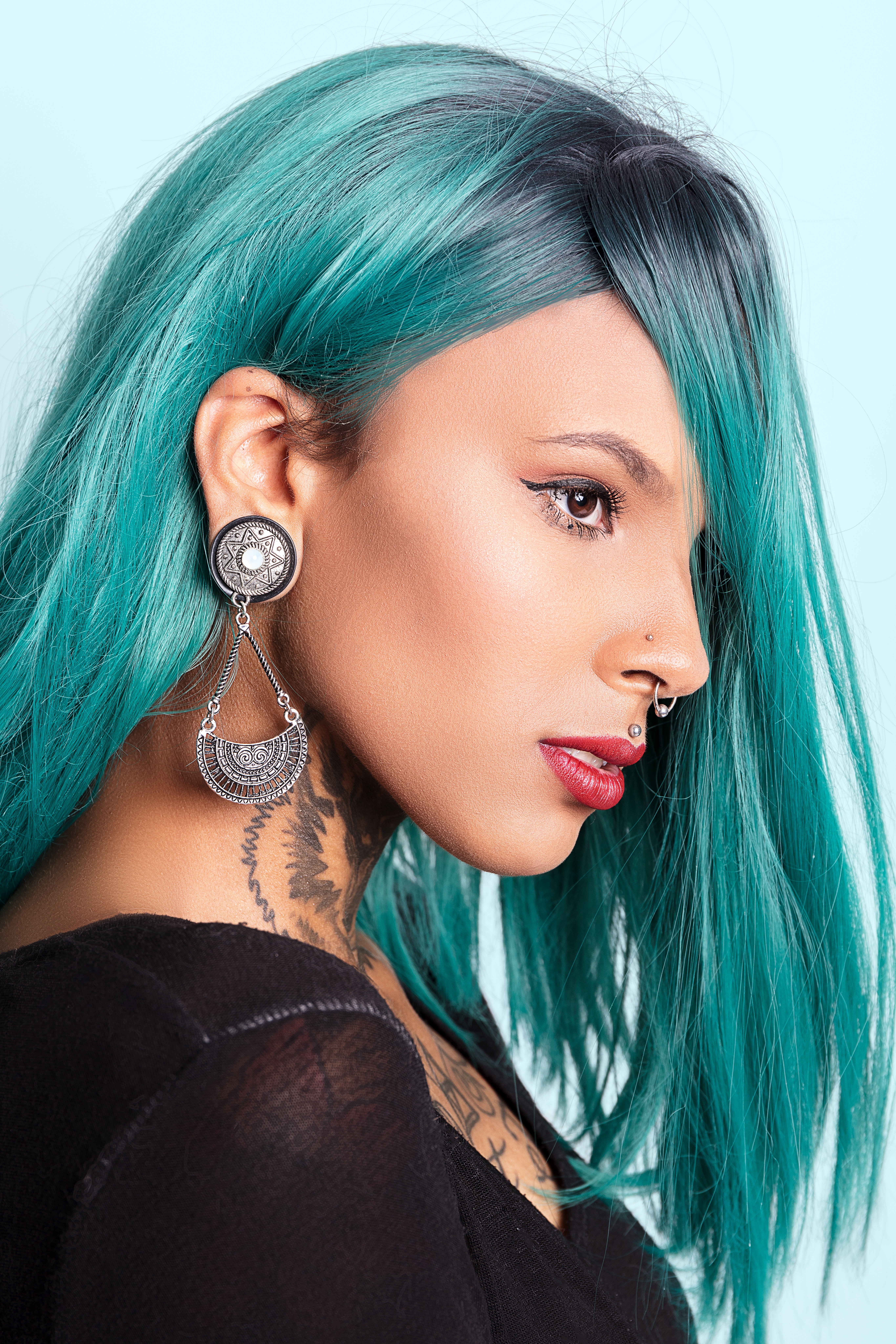 a-tattooed-woman-with-dyed-hair-and-piercings