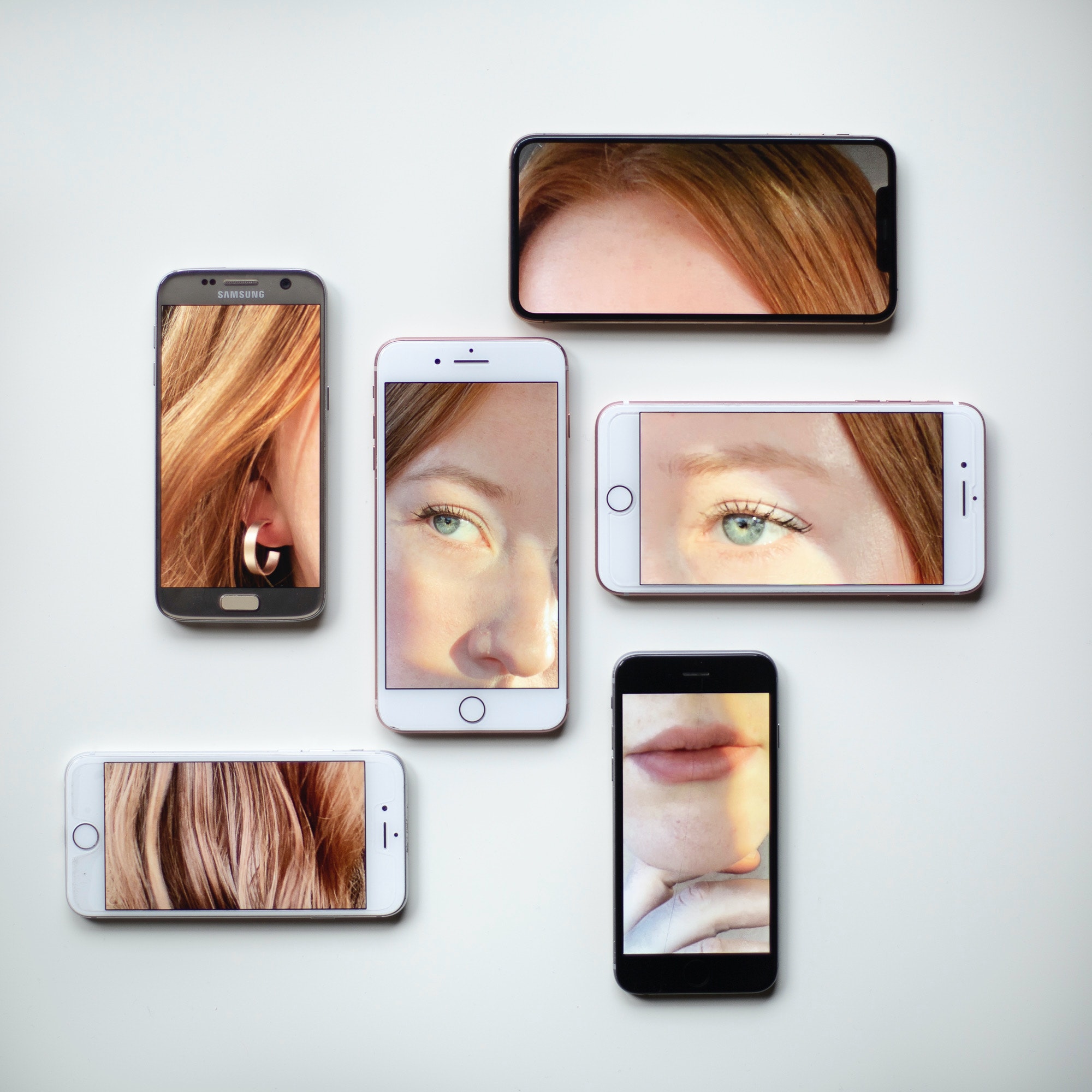 collage-of-smartphones-with-woman-portrait-on-surface
