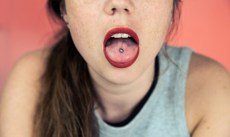 Why Is Tongue Piercing Significant in Both Ancient Rituals and Modern Expression?